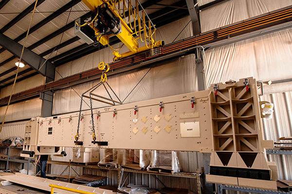 Large-scale assembly equipment and overhead crane shown on the AMT Huntsville website