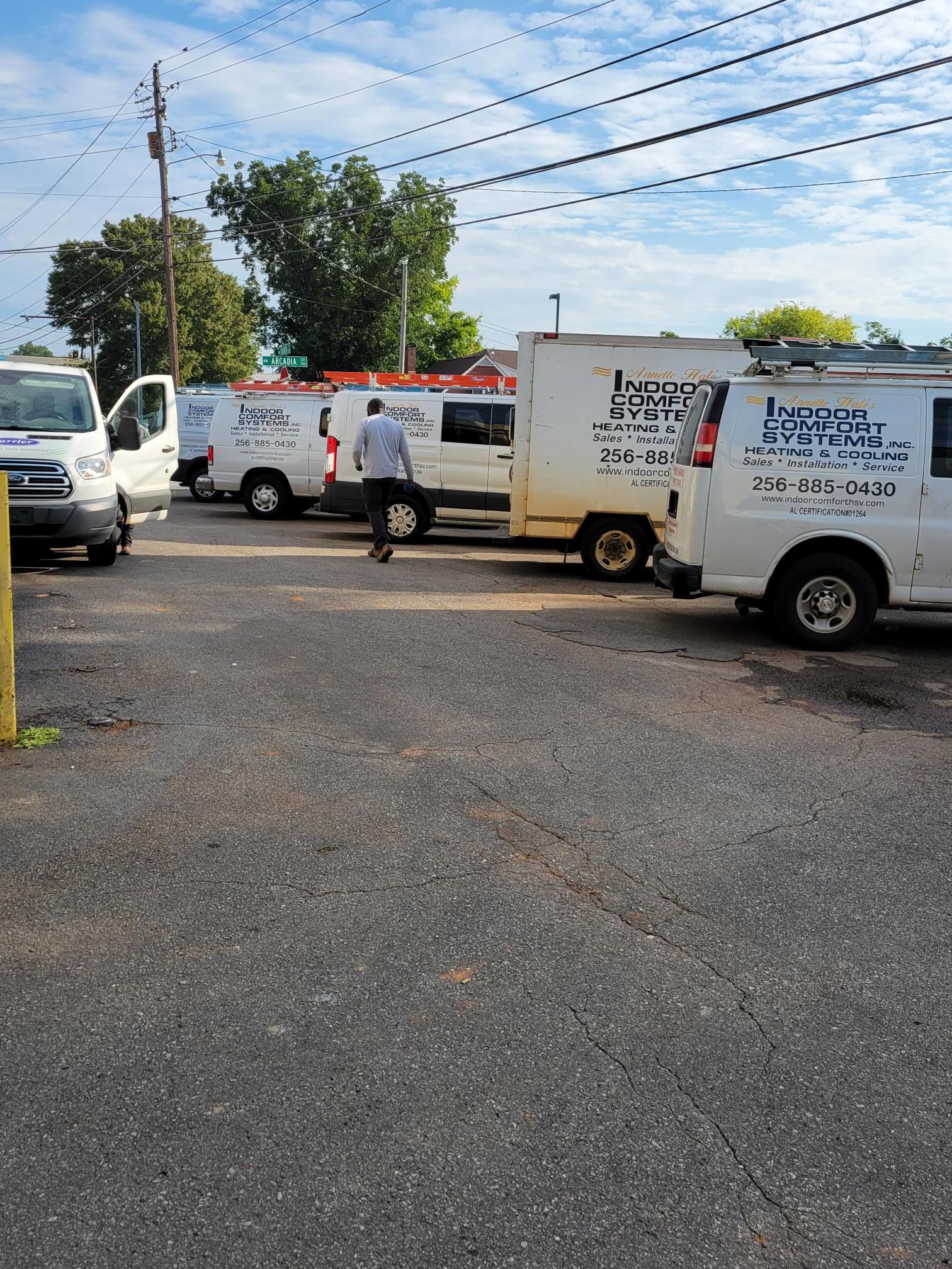 Indoor Comfort Systems service vans with a technician preparing for the day
